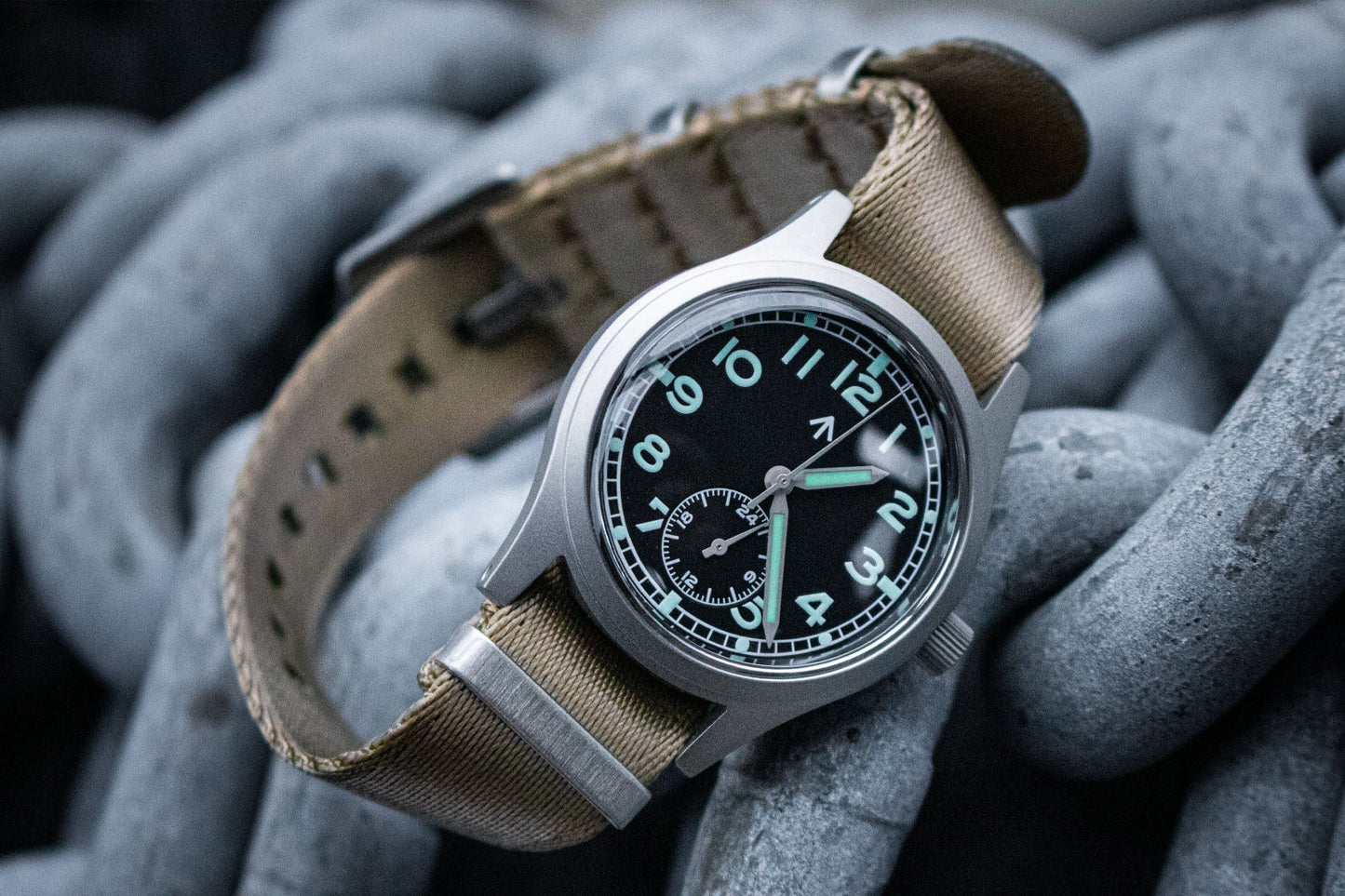 Aeschbach x Enoksen 'Fly' E03/H watch, a modern reimagining of the WWII Dirty Dozen field watch, ready for adventure with 100m water resistance.