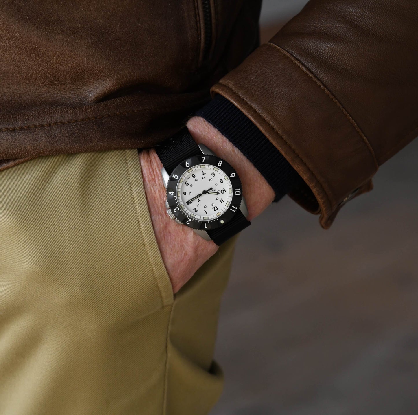 Male model wearing the By Enoksen Tactic E09A watch on a black Nato strap.