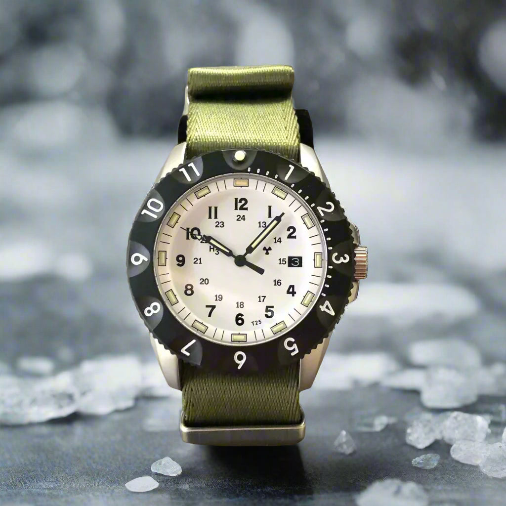 Enoksen Tactic E09/A tactical watch. Features a sandblasted steel case, sapphire crystal, and Swiss Tritium illumination. On a green NATO strap.