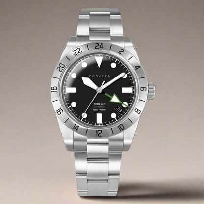 GMT watch, close-up. Emphasizes the quality of the watch and clearly shows the green GMT hand set against the black dial, providing a classic appearance.