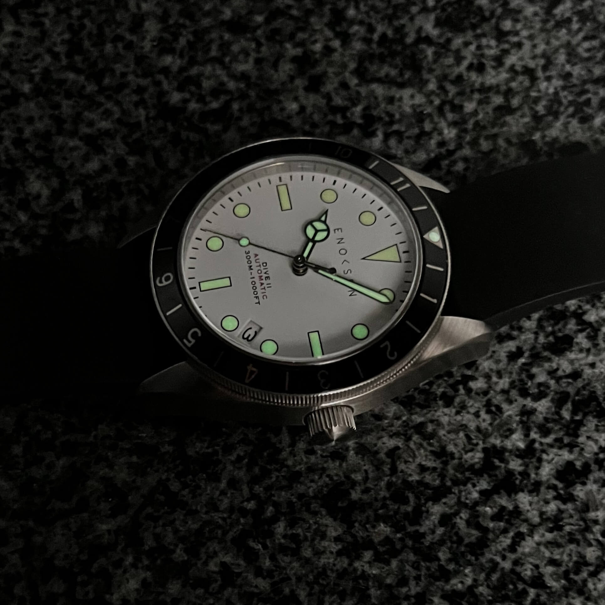 Swiss Super-LumiNova glow on hands, markers and bezel triangle in low light.