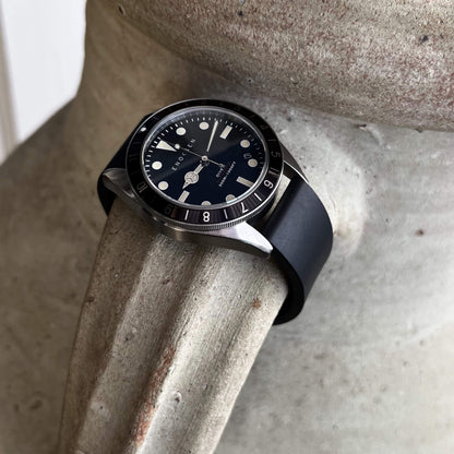 Dive II black dial edition on black rubber strap, angled view showing case profile and bezel.