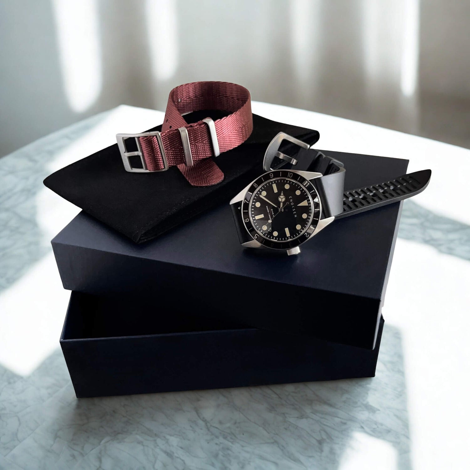 Dive II with presentation box, black rubber strap and burgundy herringbone woven strap.