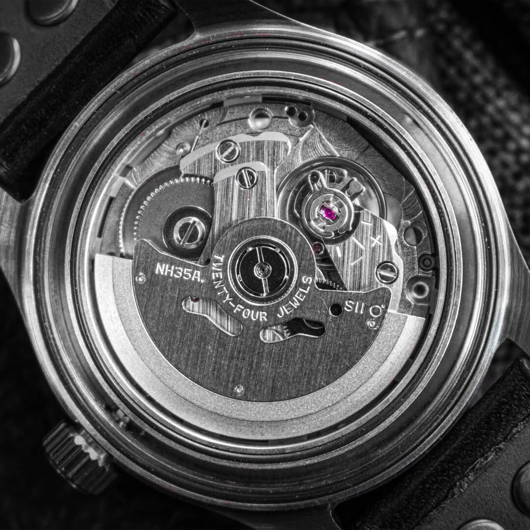 Seiko NH35A automatic movement macro, showing rotor, bridge and regulation details.