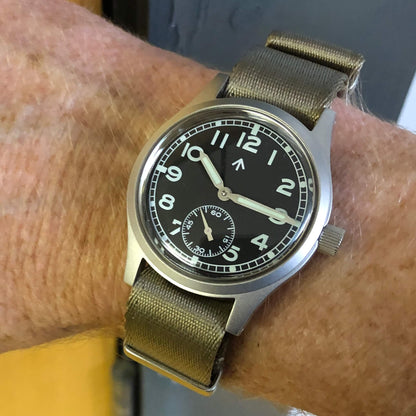 Enoksen Fly E03 36mm watch with black dial worn on a wrist size 18cm, showcasing the proportions and military case shape make it wear slightly larger than the numbers suggest.