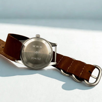 Caseback view of the Dirty Dozen Swiss Edition on leather strap. W.W.W and serial number engraved.