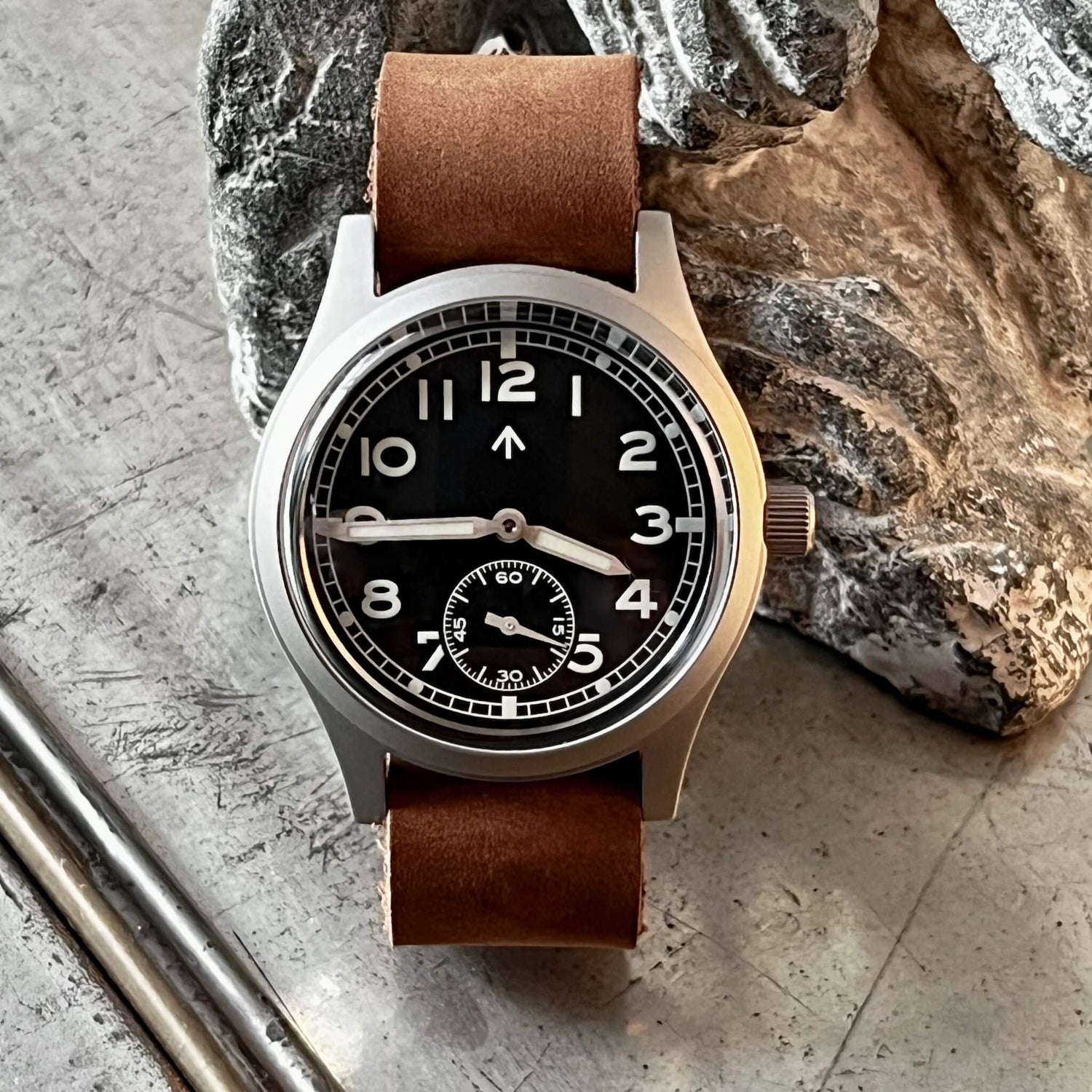 Front view of Enoksen Dirty Dozen - Automatic - Swiss Edition 36mm showcasing the compact, wearable, and perfectly balanced watch on brown leather strap, just like the original field watches.
