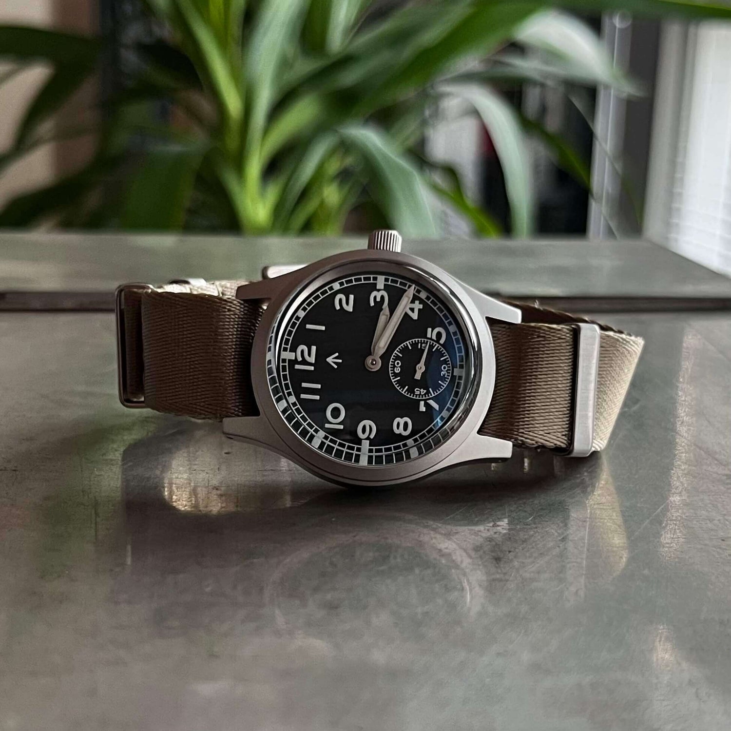 The Enoksen Swiss edition of Dirty Dozen watch on the Khaki seatbelt NATO strap that's also included with the watch. Showcasing the casual and military inspired NATO strap offering an additional look out of the box.