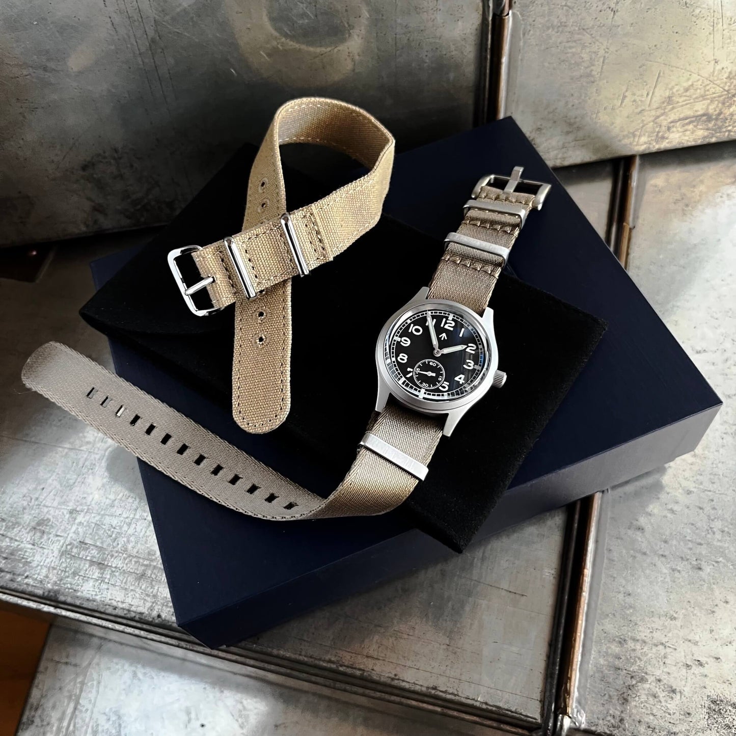 Fly E03/S with presentation box, Khaki seatbelt NATO double pass strap and beige canvas single pass strap.
