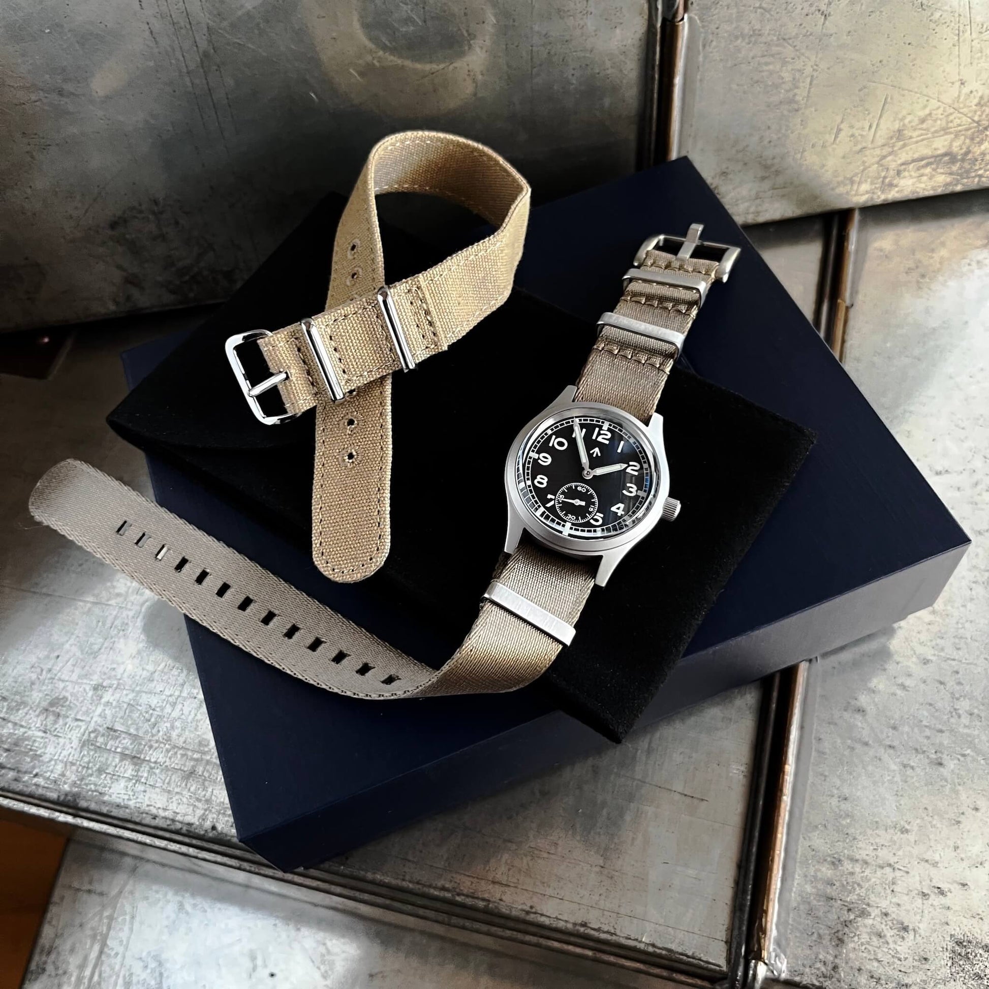 Fly E03/S with presentation box, Khaki seatbelt NATO double pass strap and beige canvas single pass strap.
